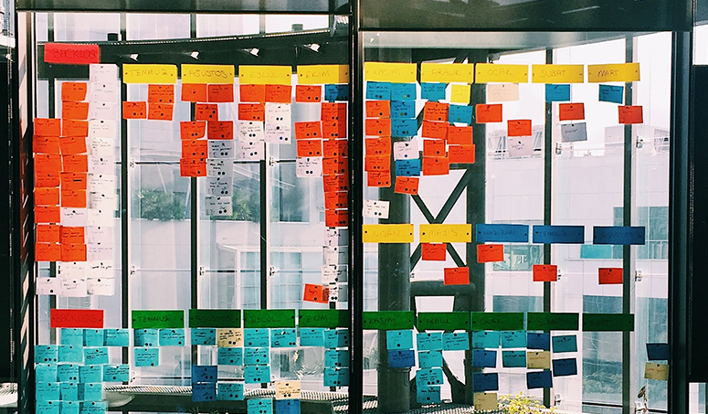 A window with many post-it notes. Photo.