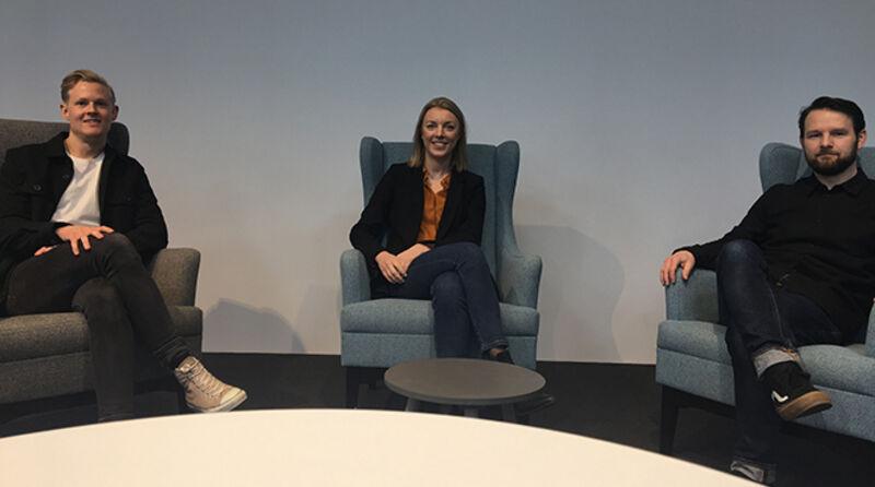 three people in chairs looking at the camera. Photo. 