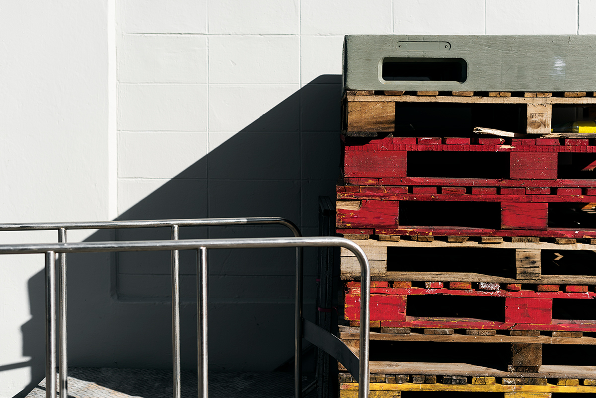 pallets stacked against a wall. photo. 